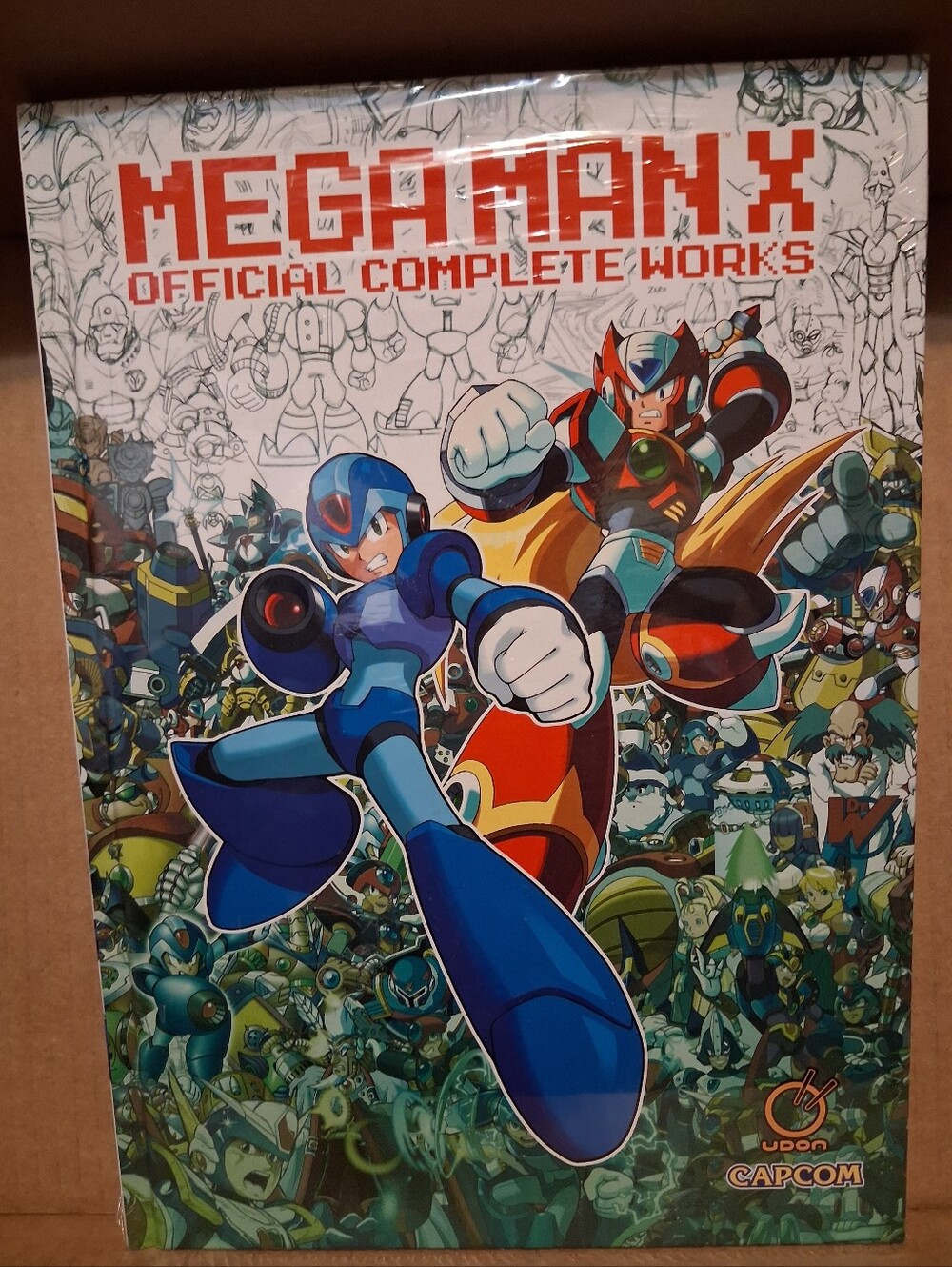 Megaman X Official Complete Works Art BookBrand new with plastic wrapping. a Ud